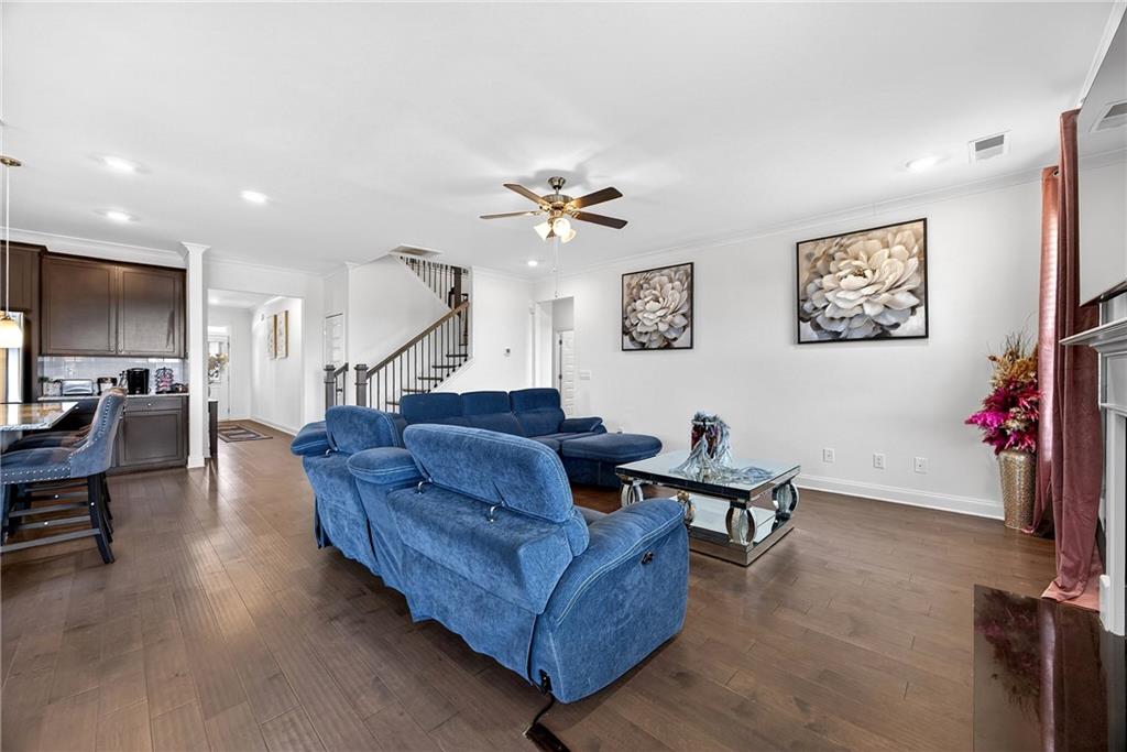 419 Beachview Road Hampton, GA 30228 - Photo 11 of 32 a living room with furniture and wooden floor