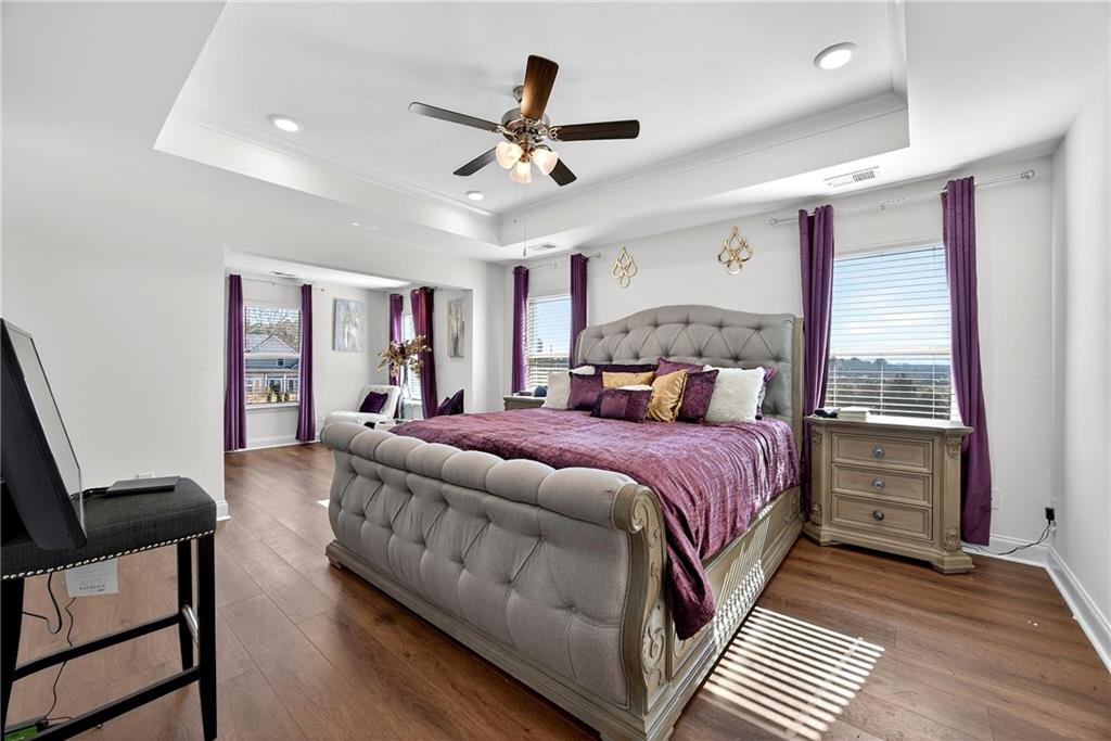 419 Beachview Road Hampton, GA 30228 - Photo 16 of 32 a bed room with a bed and a ceiling fan
