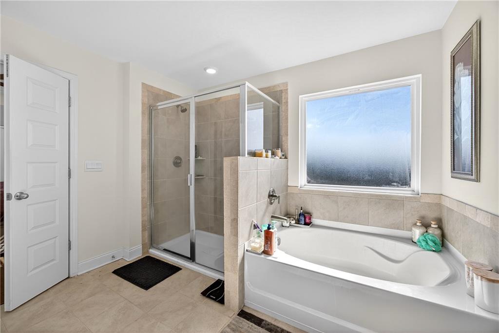 419 Beachview Road Hampton, GA 30228 - Photo 20 of 32 a bathroom with a tub shower and sink