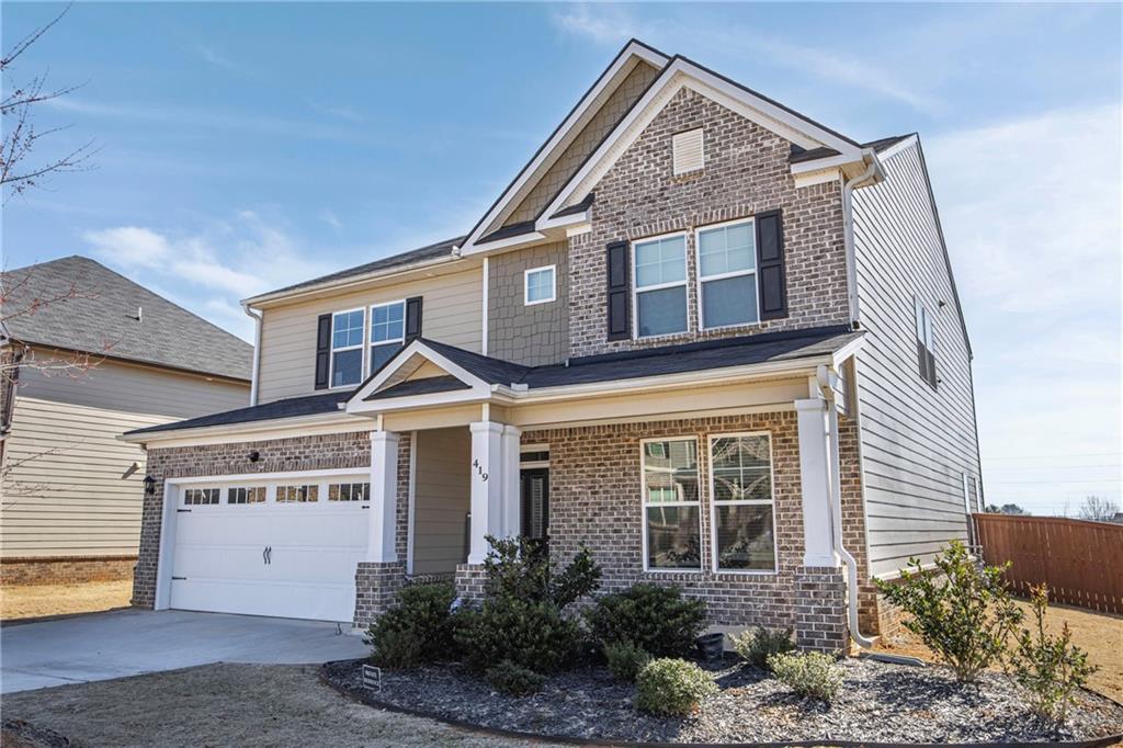 419 Beachview Road Hampton, GA 30228 - Photo 2 of 32 a front view of a house with a yard