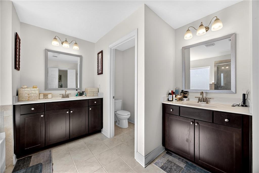419 Beachview Road Hampton, GA 30228 - Photo 21 of 32 a spacious bathroom with a double vanity sink double and mirror