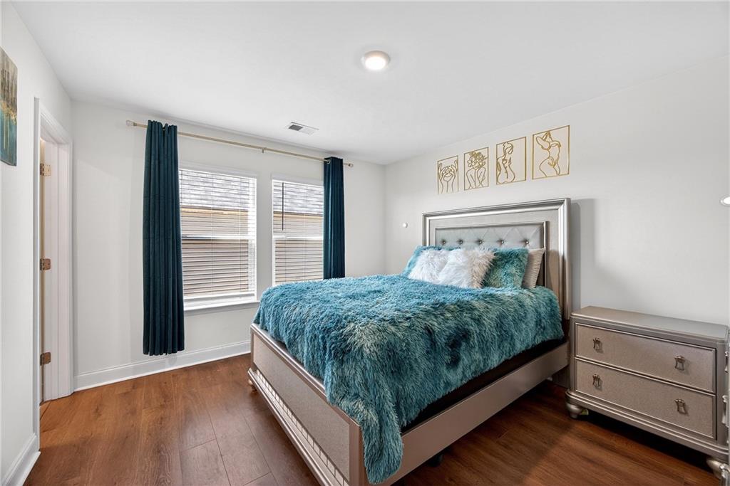419 Beachview Road Hampton, GA 30228 - Photo 22 of 32 a bed sitting in a bedroom next to a window