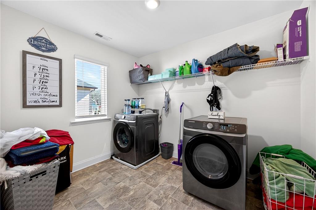 419 Beachview Road Hampton, GA 30228 - Photo 26 of 32 a utility room with sink dryer and washer
