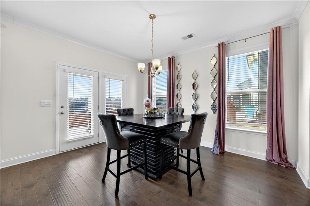 419 Beachview Road Hampton, GA 30228 - Photo 9 of 32 a view of a dining room with furniture window and wooden floor