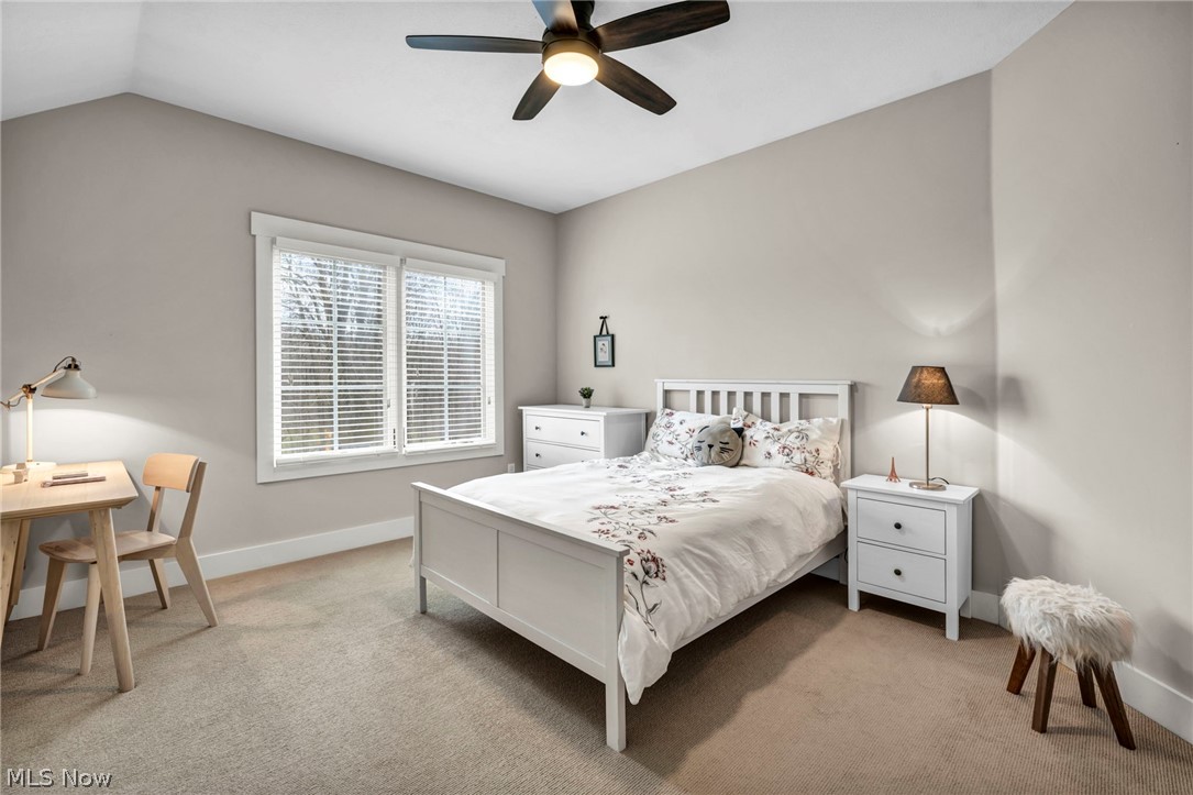 11295 Sutton Place Chardon, OH 44024 - Photo 35 of 50 Bedroom with light carpet, a ceiling fan, and vaulted ceiling