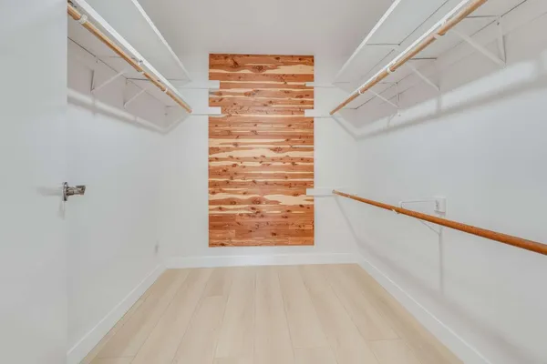 a view of an empty room and staircase