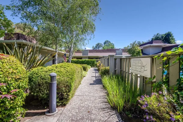 a view of a pathway in front of house
