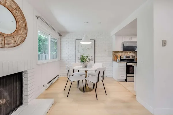 a dining room with furniture and window