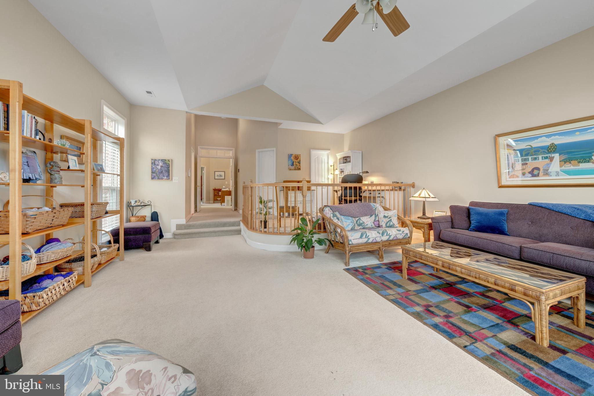 1925 Logan Manor Drive Reston, VA 20190 - Photo 22 of 61 a living room with furniture and a book shelf
