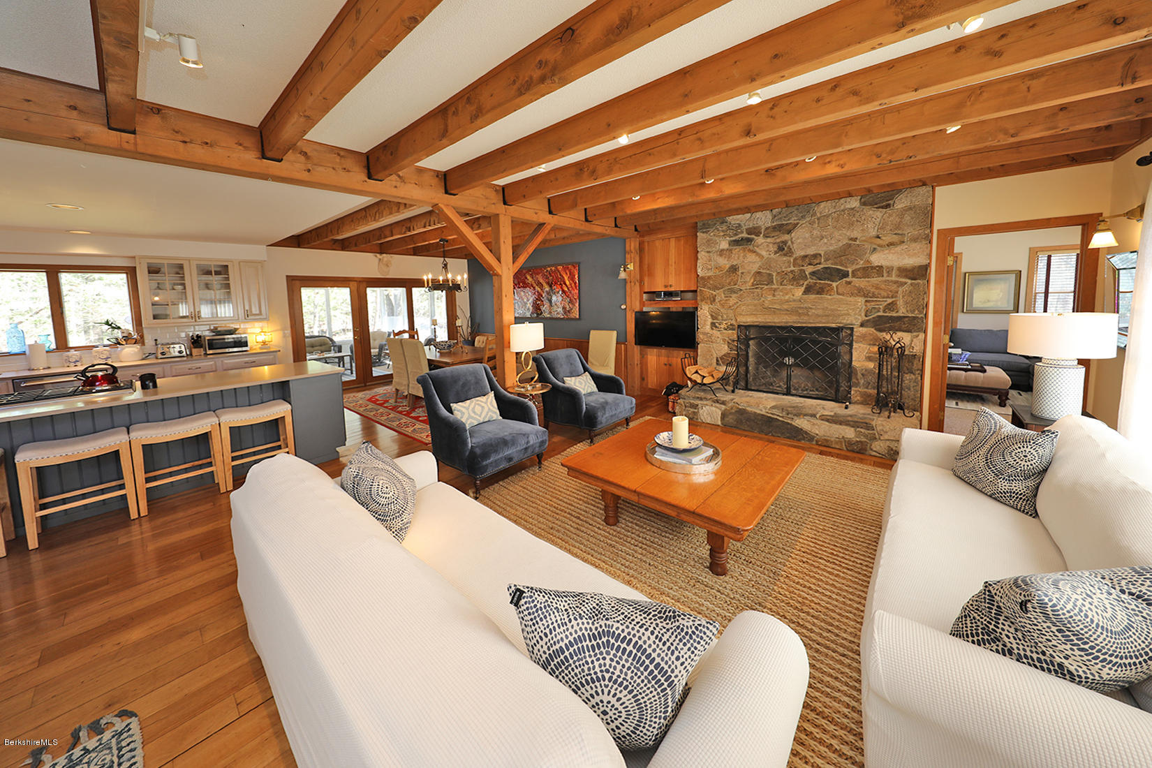183 Judd Road Otis, MA 01253 - Photo 36 of 38 a living room with furniture a fireplace and wooden floors