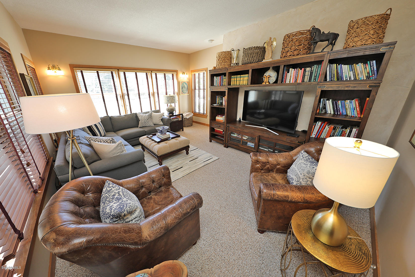 183 Judd Road Otis, MA 01253 - Photo 9 of 38 a living room with furniture and a flat screen tv