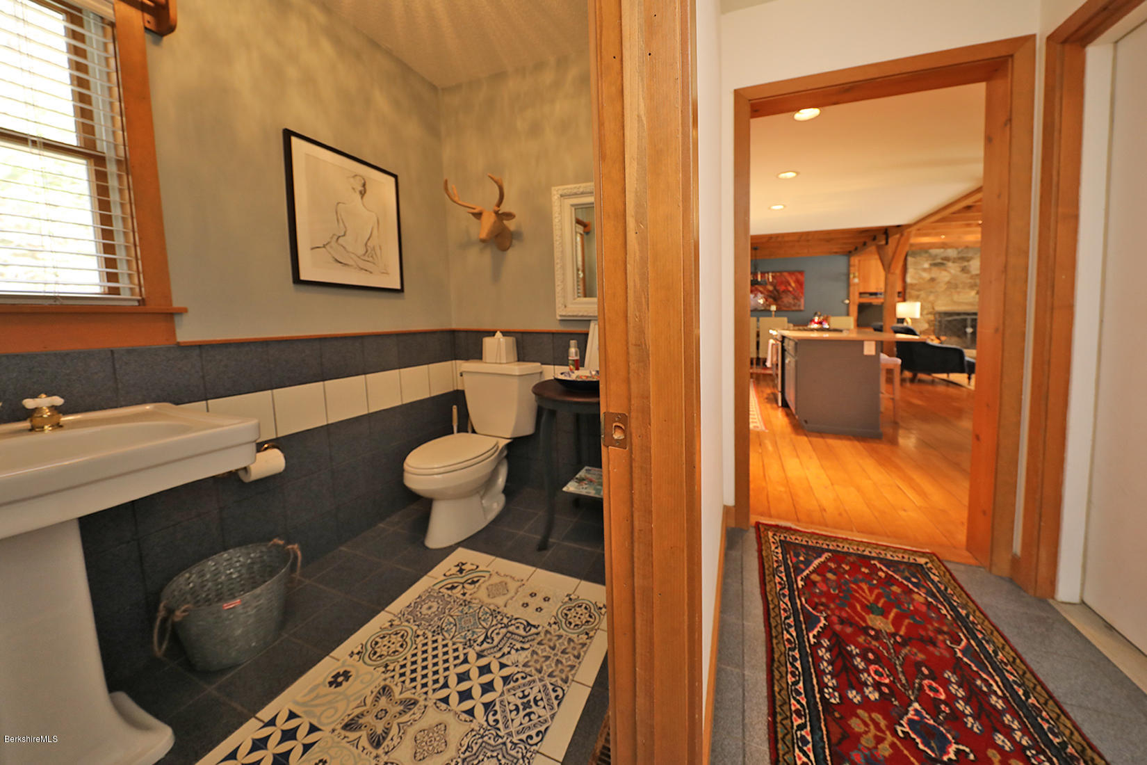 183 Judd Road Otis, MA 01253 - Photo 15 of 38 a bathroom with a sink and mirror with toilet