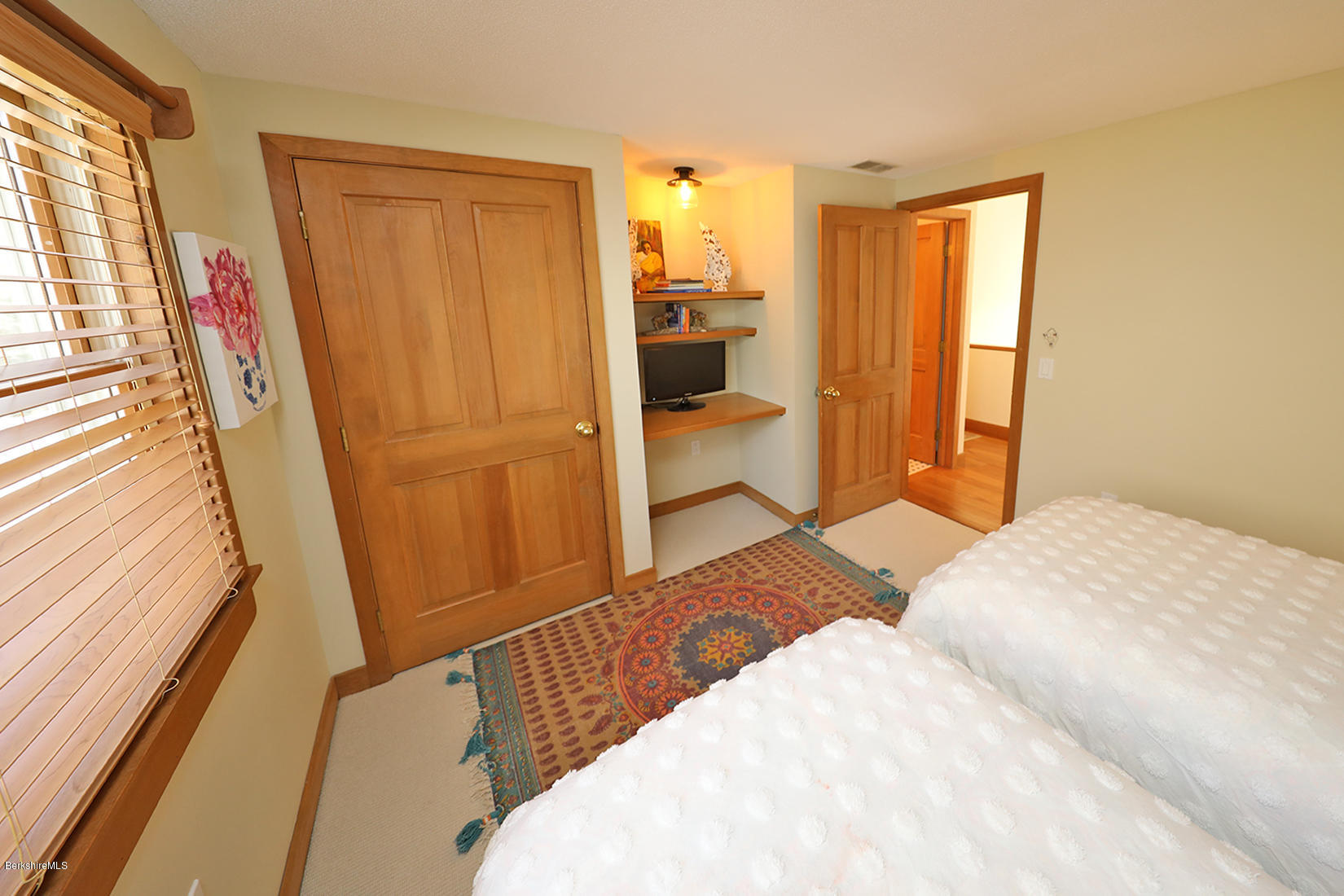 183 Judd Road Otis, MA 01253 - Photo 25 of 38 a bedroom with a bed and a refrigerator