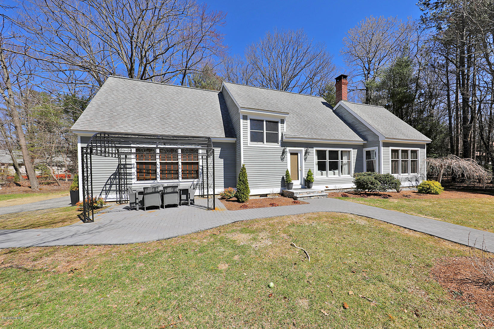 183 Judd Road Otis, MA 01253 - Photo 32 of 38 a front view of a house with swimming pool and porch
