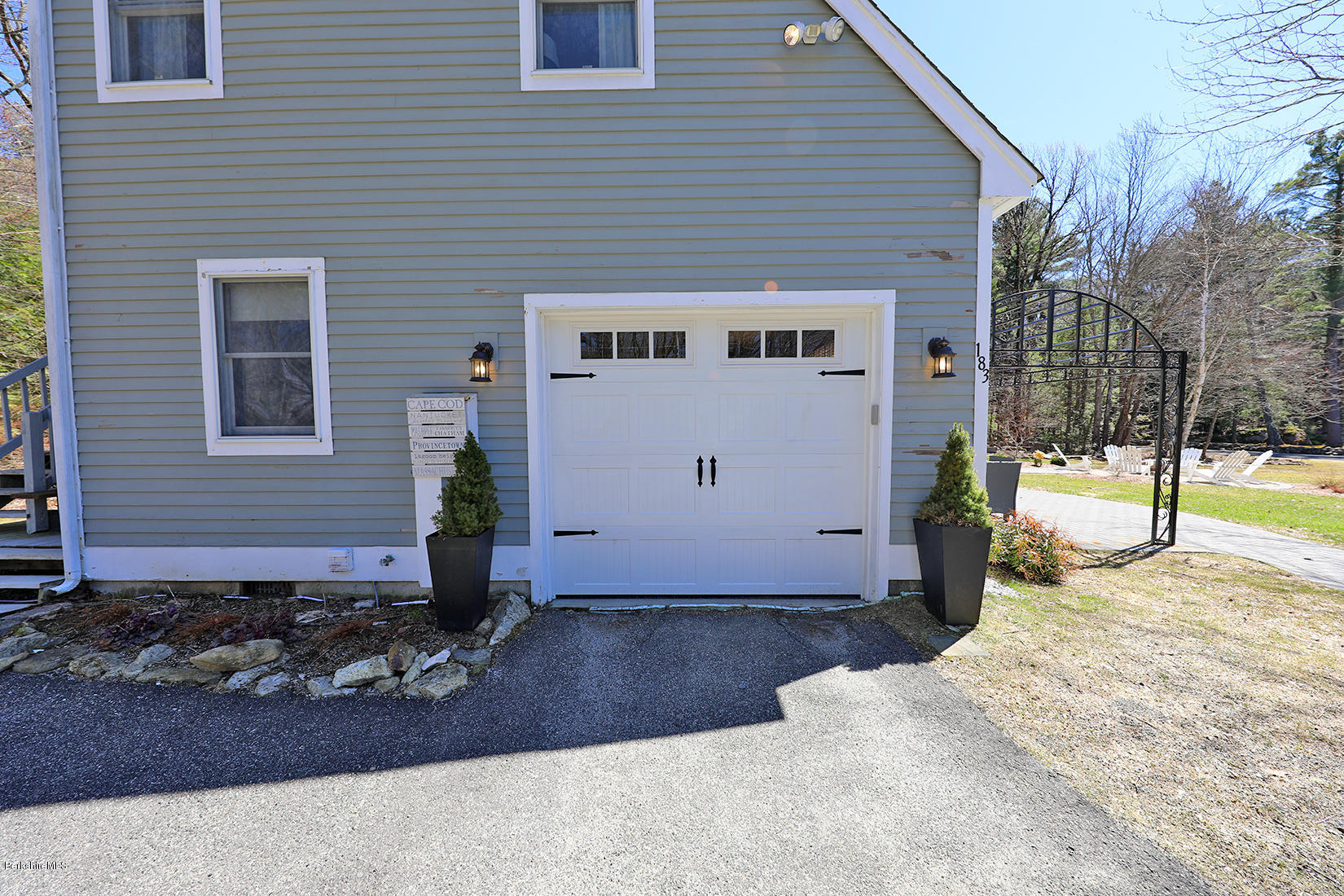 183 Judd Road Otis, MA 01253 - Photo 34 of 38 a view of a house with a small yard and wooden fence