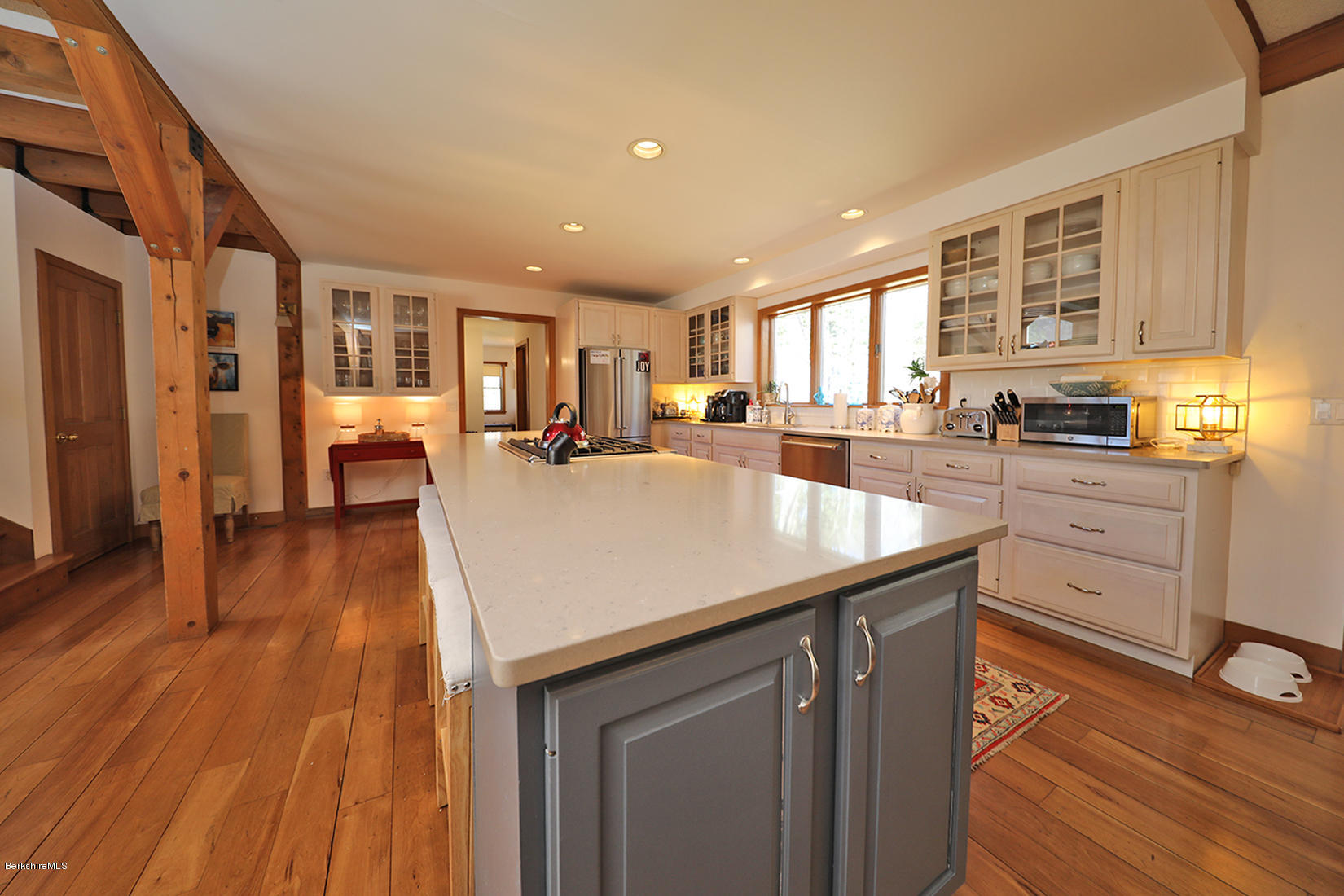 183 Judd Road Otis, MA 01253 - Photo 5 of 38 a kitchen with stainless steel appliances granite countertop a sink stove and wooden floor