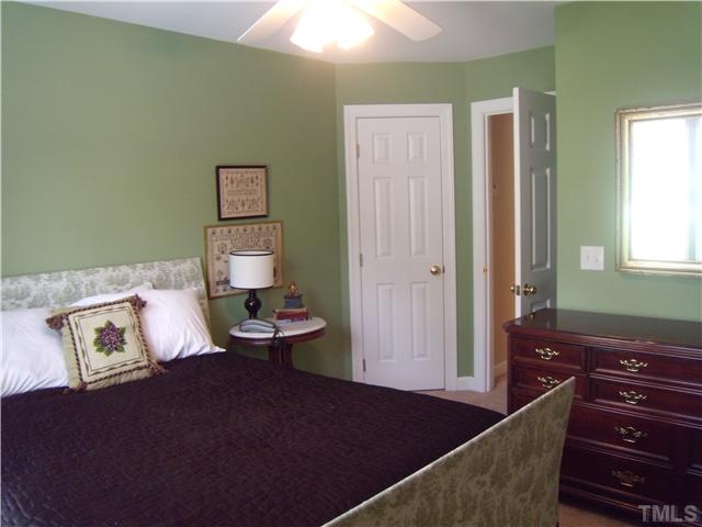 3809 La Costa Way Raleigh, NC 27610 - Photo 12 of 25 a living room with a couch and a chandelier