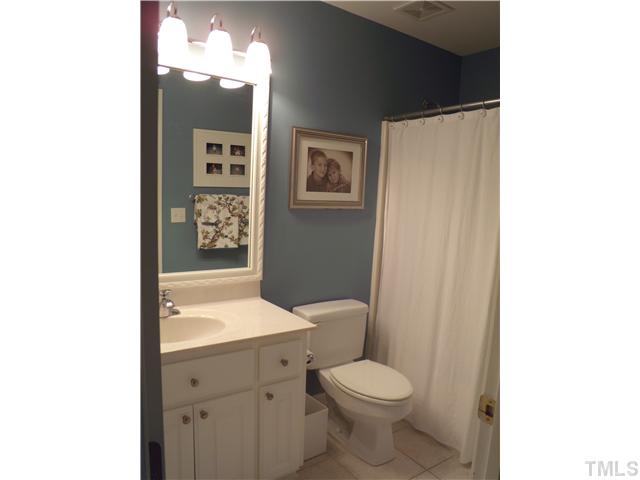 3809 La Costa Way Raleigh, NC 27610 - Photo 13 of 25 a bathroom with a toilet a sink and mirror