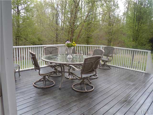 3809 La Costa Way Raleigh, NC 27610 - Photo 20 of 25 a view of balcony with wooden floor and seating space