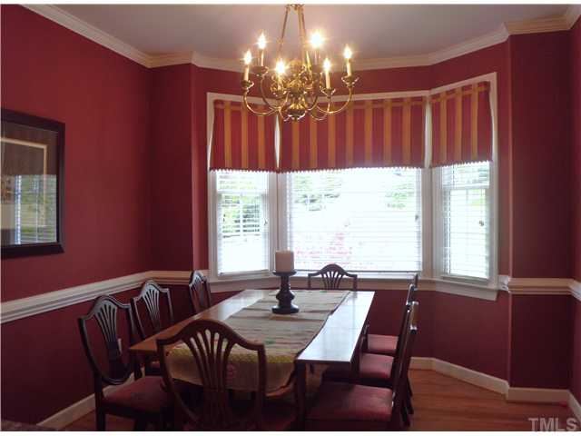 3809 La Costa Way Raleigh, NC 27610 - Photo 7 of 25 a view of a dining room with furniture and chandelier