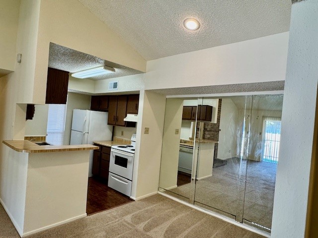 a kitchen with a sink stainless steel appliances and cabinets