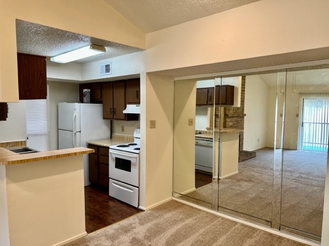 9229 Imogene Street, Unit 9229 Houston, TX 77036 - Photo 20 of 24 a kitchen with stainless steel appliances granite countertop a refrigerator and a stove