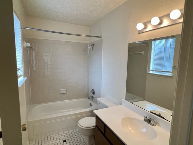 9229 Imogene Street, Unit 9229 Houston, TX 77036 - Photo 23 of 24 a bathroom with a sink toilet and shower