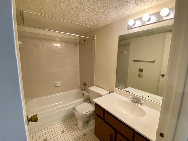 9229 Imogene Street, Unit 9229 Houston, TX 77036 - Photo 4 of 24 a bathroom with a sink toilet and shower