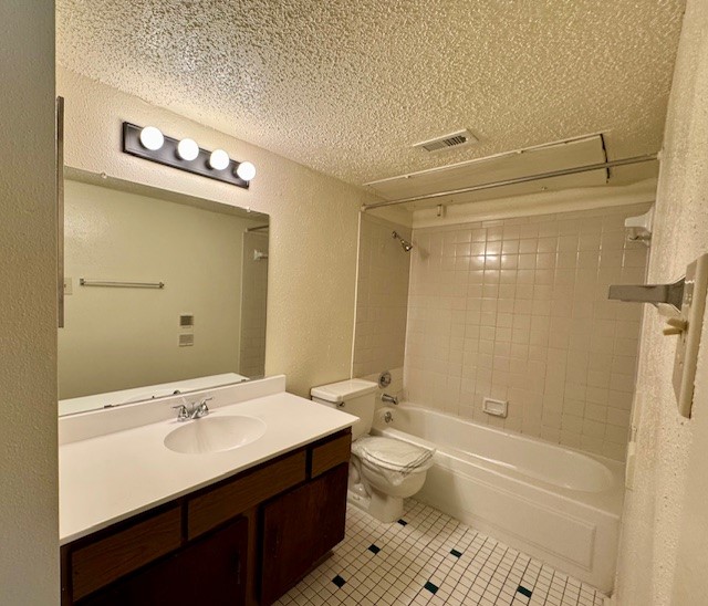 9229 Imogene Street, Unit 9229 Houston, TX 77036 - Photo 7 of 24 a bathroom with a sink a toilet a mirror and shower