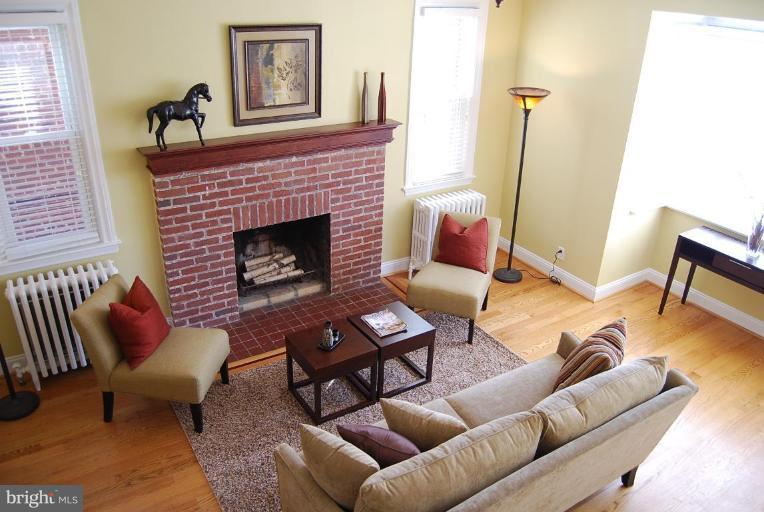 1365 Rittenhouse Street Northwest Washington, DC 20011 - Photo 4 of 25 Inviting Living Room with Wood-Burning Fireplace.