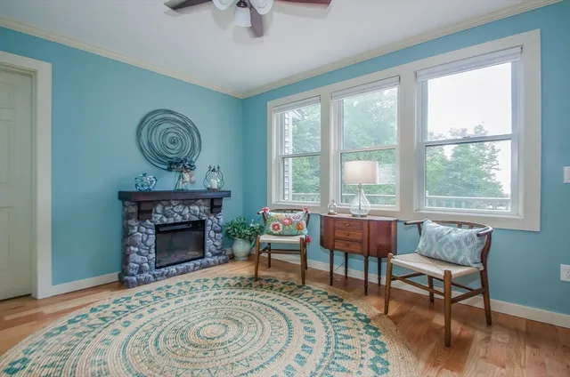 a living room with furniture and a fireplace