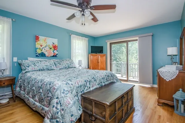 a living room with a bed and a chandelier