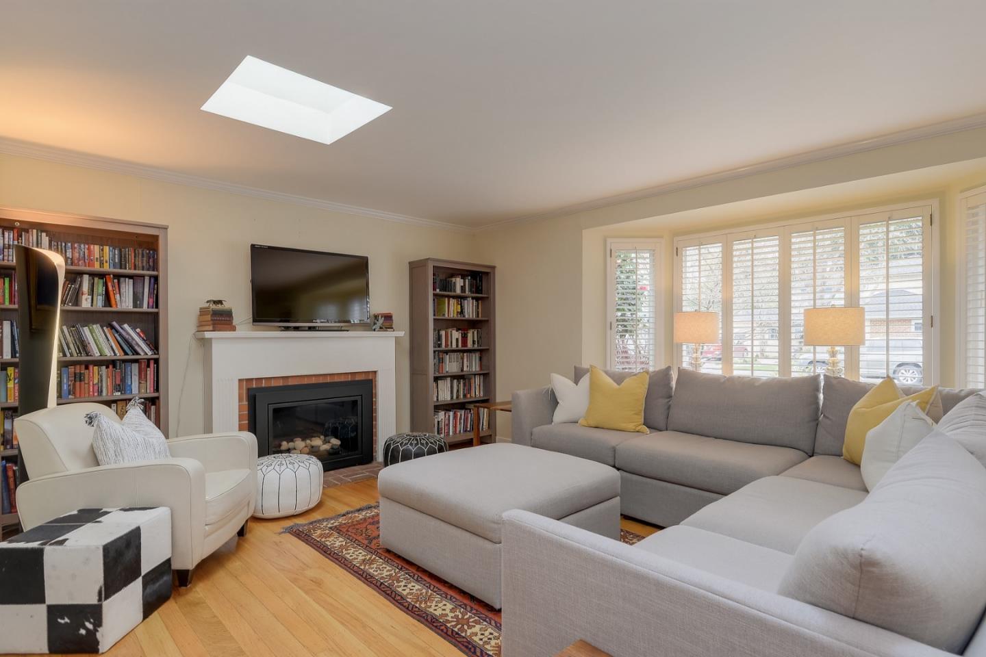 311 Concord Drive Menlo Park, CA 94025 - Photo 3 of 15 a living room with furniture fireplace and a flat screen tv