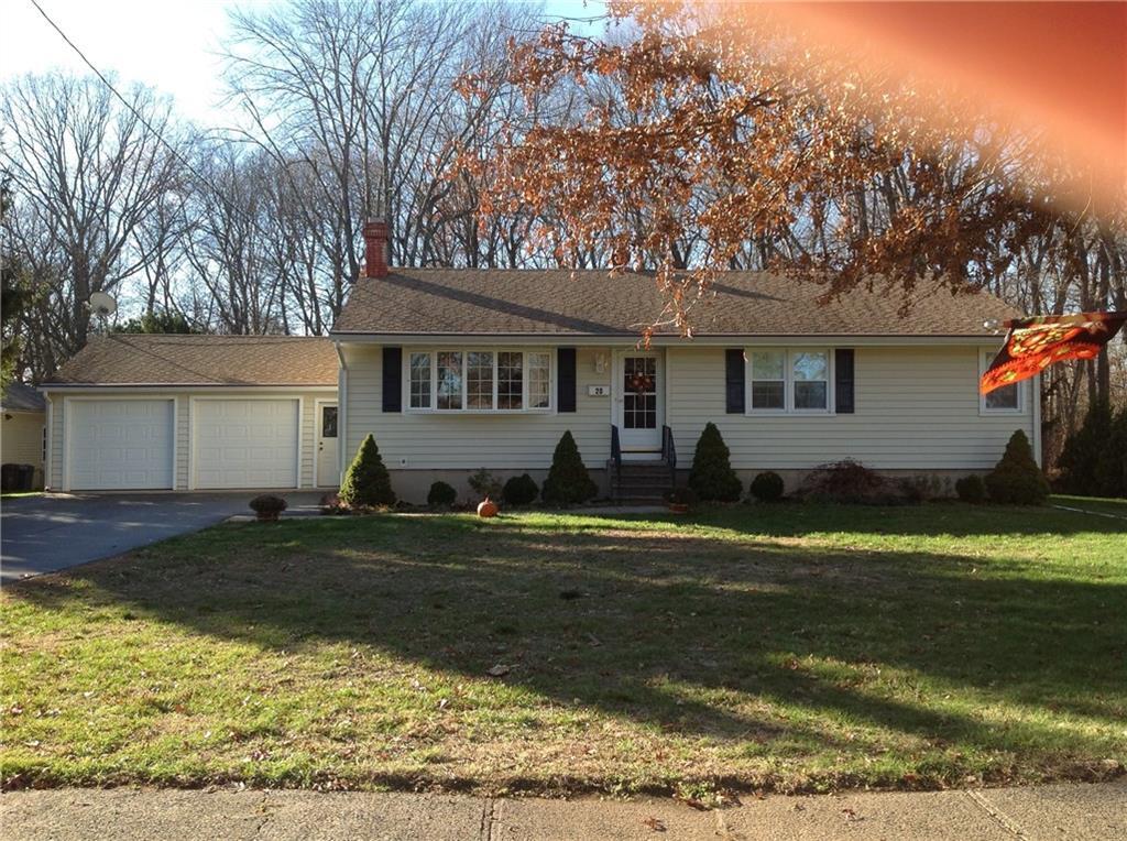 a front view of house with yard and green space