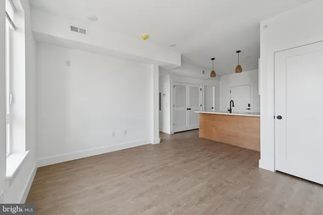 a view of a kitchen with a sink