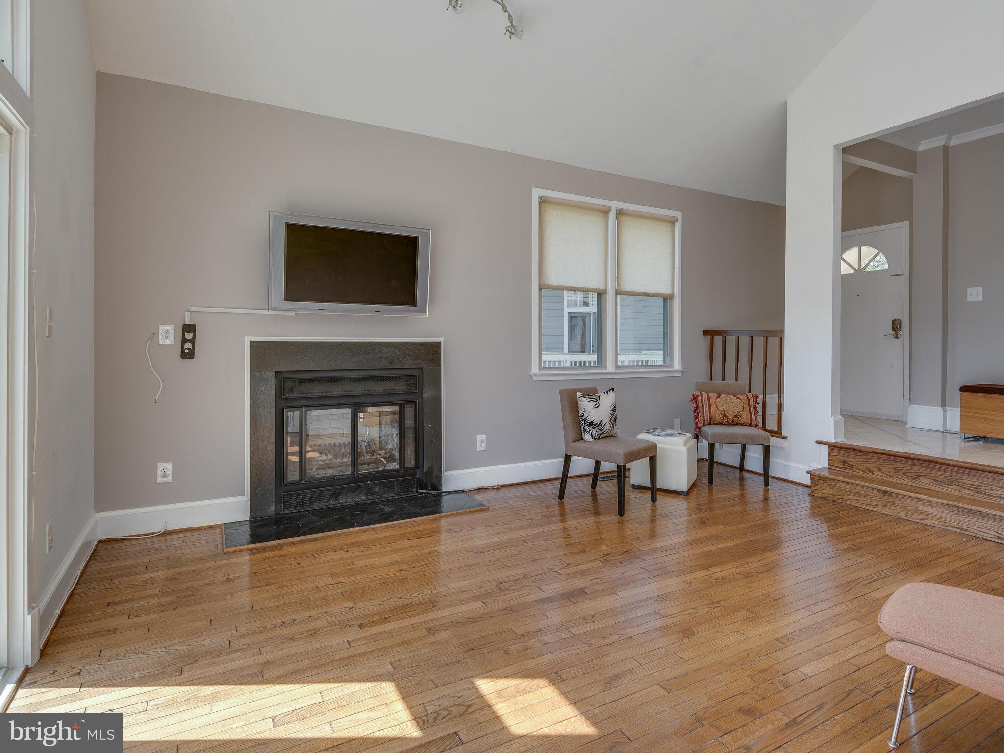 11131 Lake Chapel Lane Reston, VA 20191 - Photo 14 of 30 a living room with furniture and a fireplace