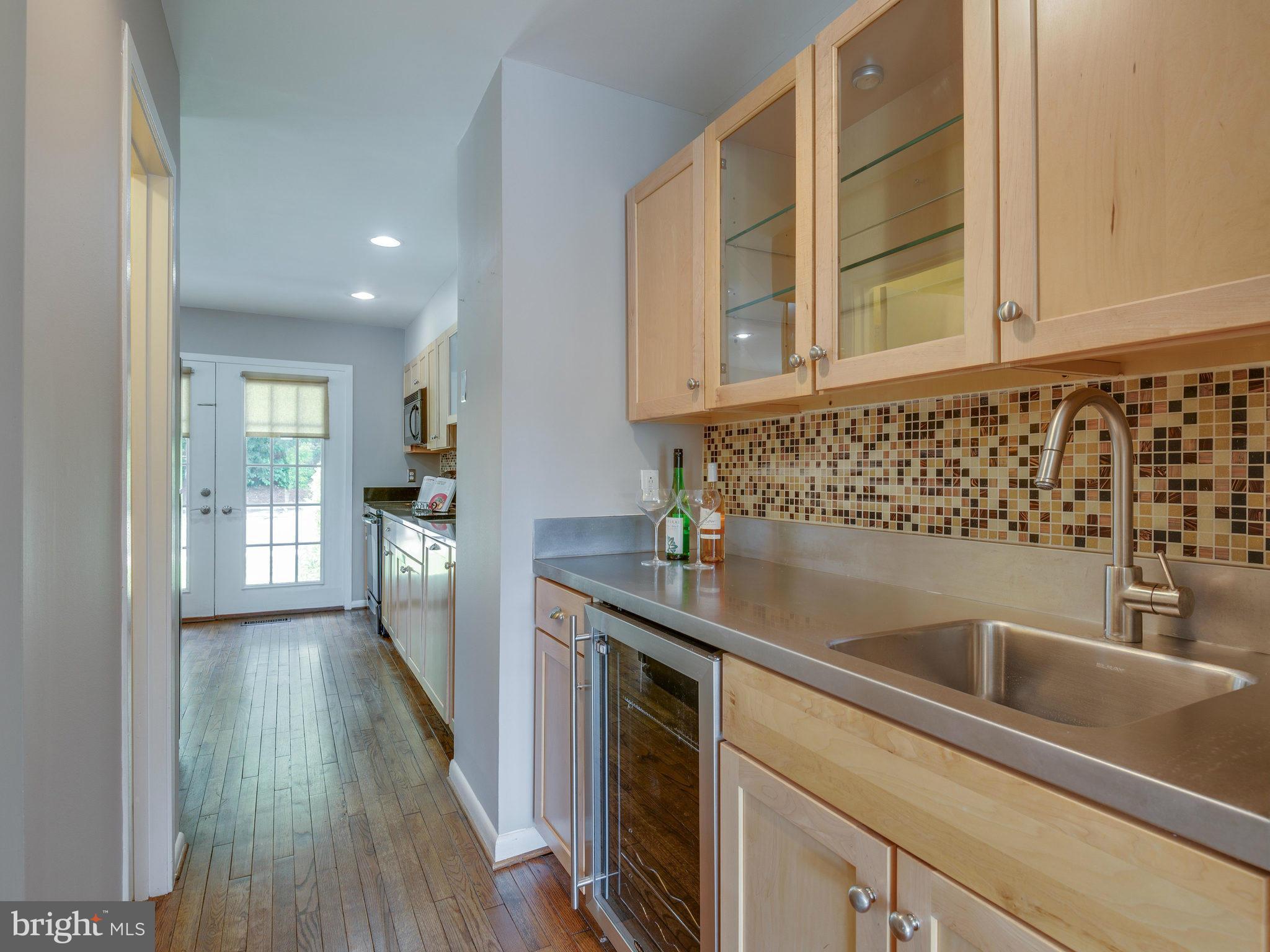 11131 Lake Chapel Lane Reston, VA 20191 - Photo 16 of 30 a kitchen with granite countertop a sink and a stove top oven