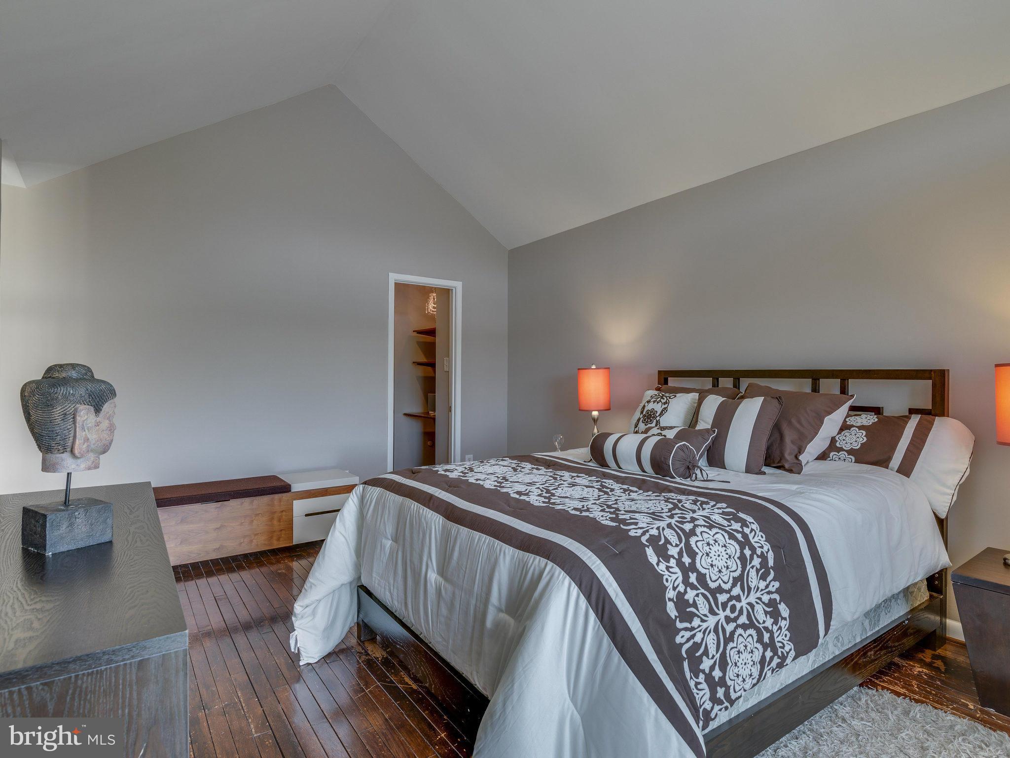 11131 Lake Chapel Lane Reston, VA 20191 - Photo 18 of 30 a bedroom with a bed and mirror