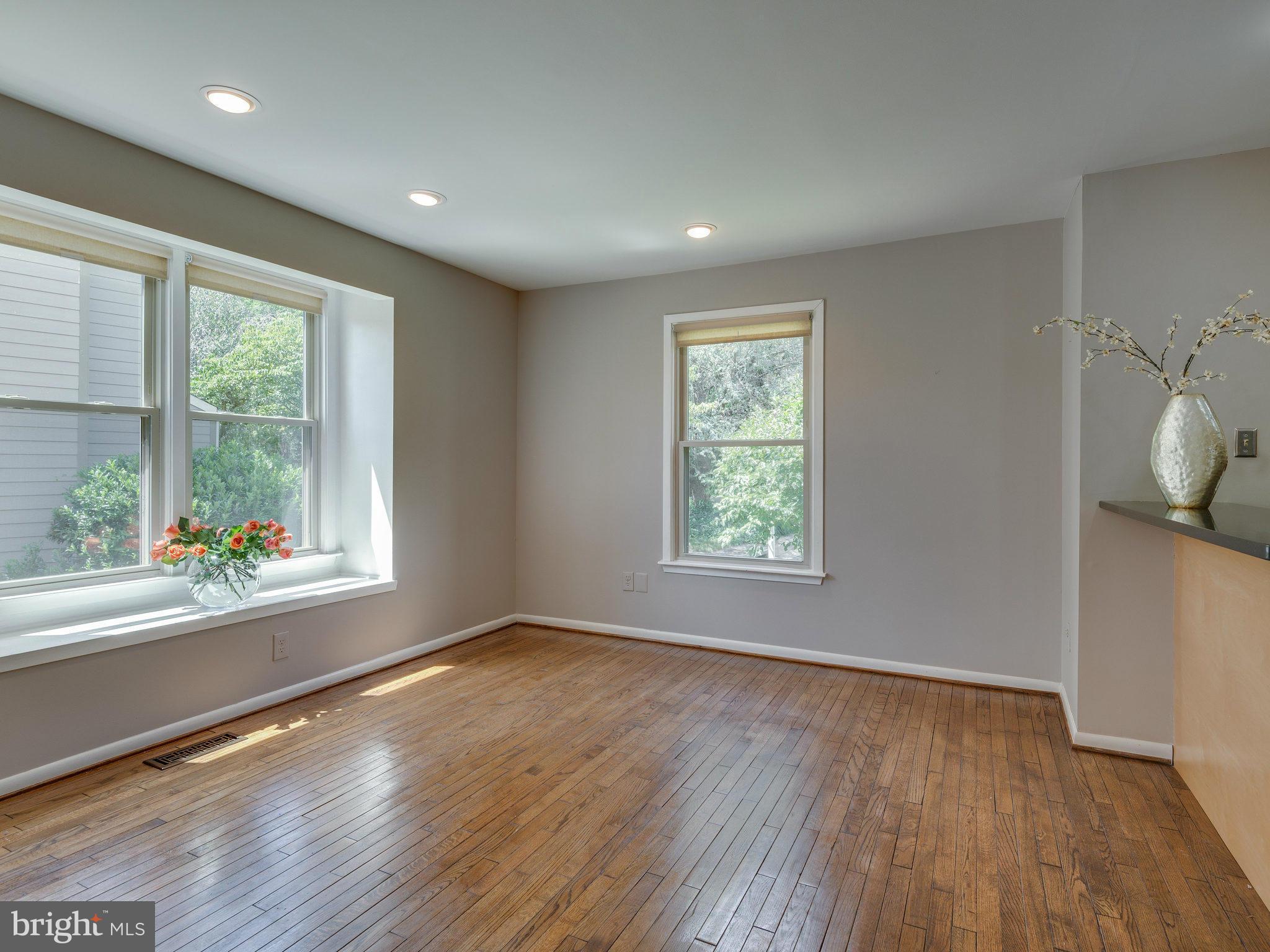 11131 Lake Chapel Lane Reston, VA 20191 - Photo 7 of 30 a view of an empty room with wooden floor and a window