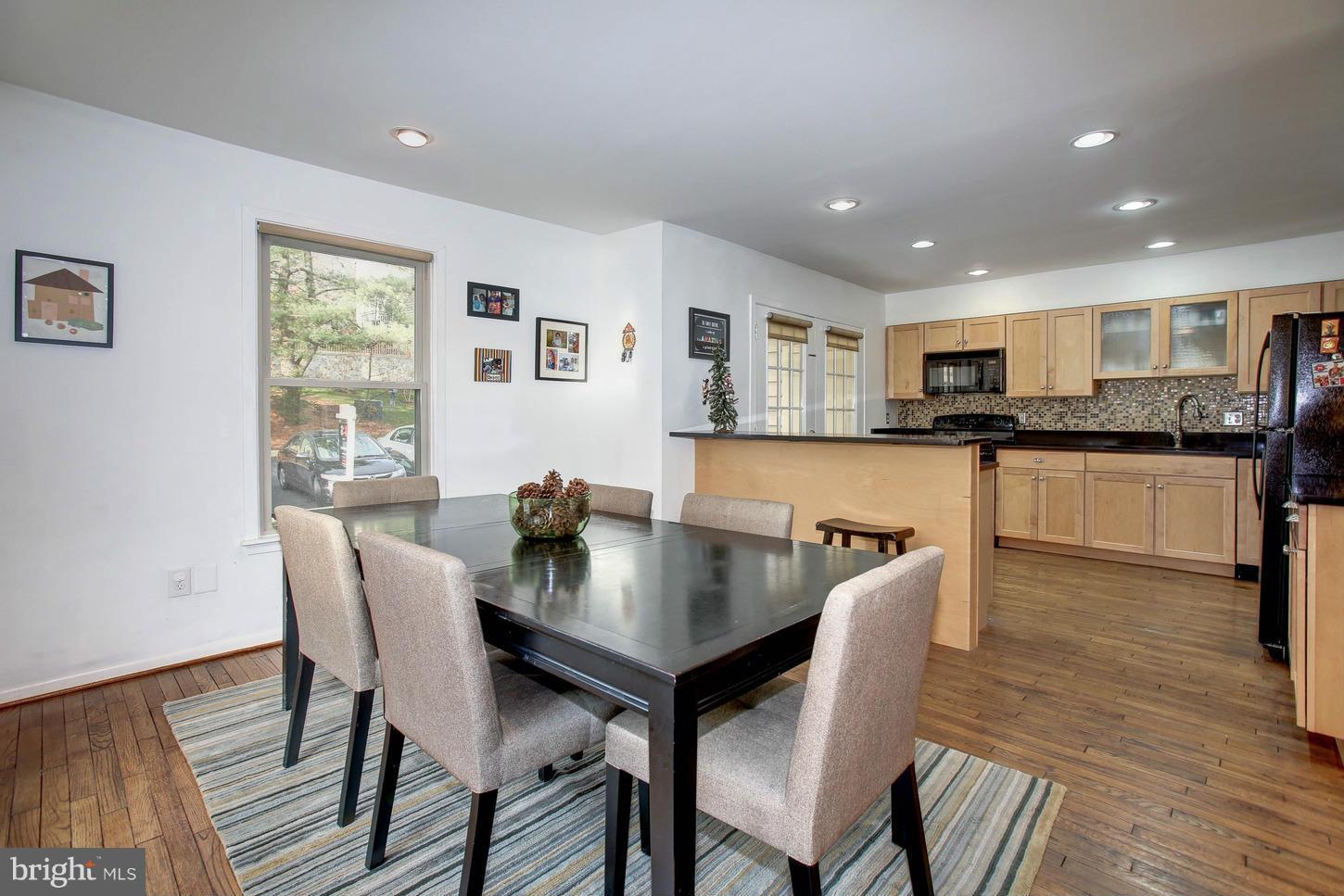 11131 Lake Chapel Lane Reston, VA 20191 - Photo 8 of 30 a view of a dining room with furniture and wooden floor