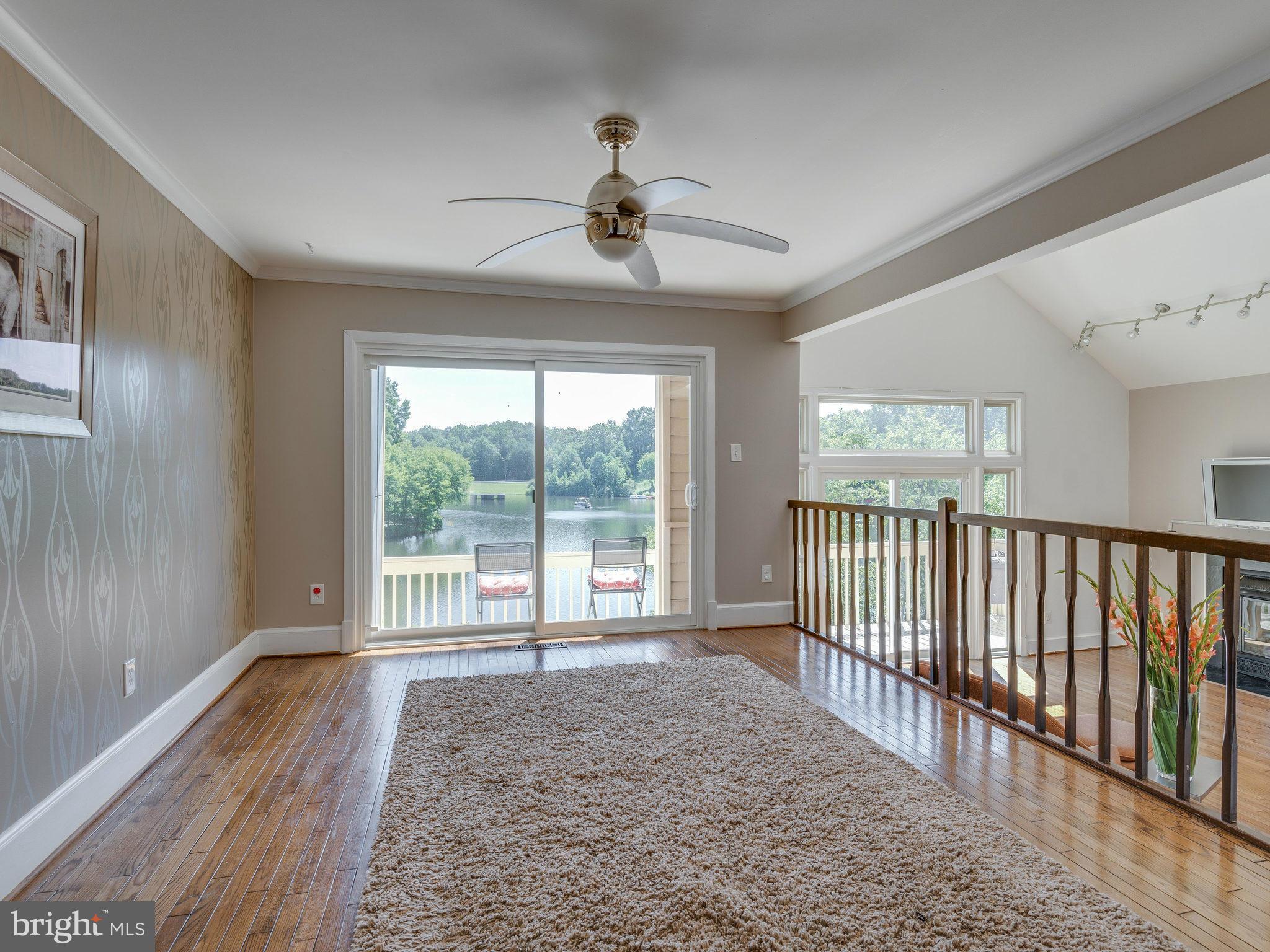 11131 Lake Chapel Lane Reston, VA 20191 - Photo 9 of 30 a view of a livingroom with a ceiling fan and window