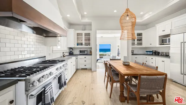 a bedroom with a large bed and a fireplace