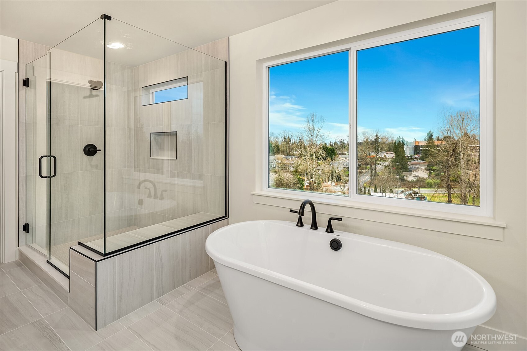 8409 Northeast 156th Street Kenmore, WA 98028 - Photo 11 of 16 a bathroom with a tub and a shower