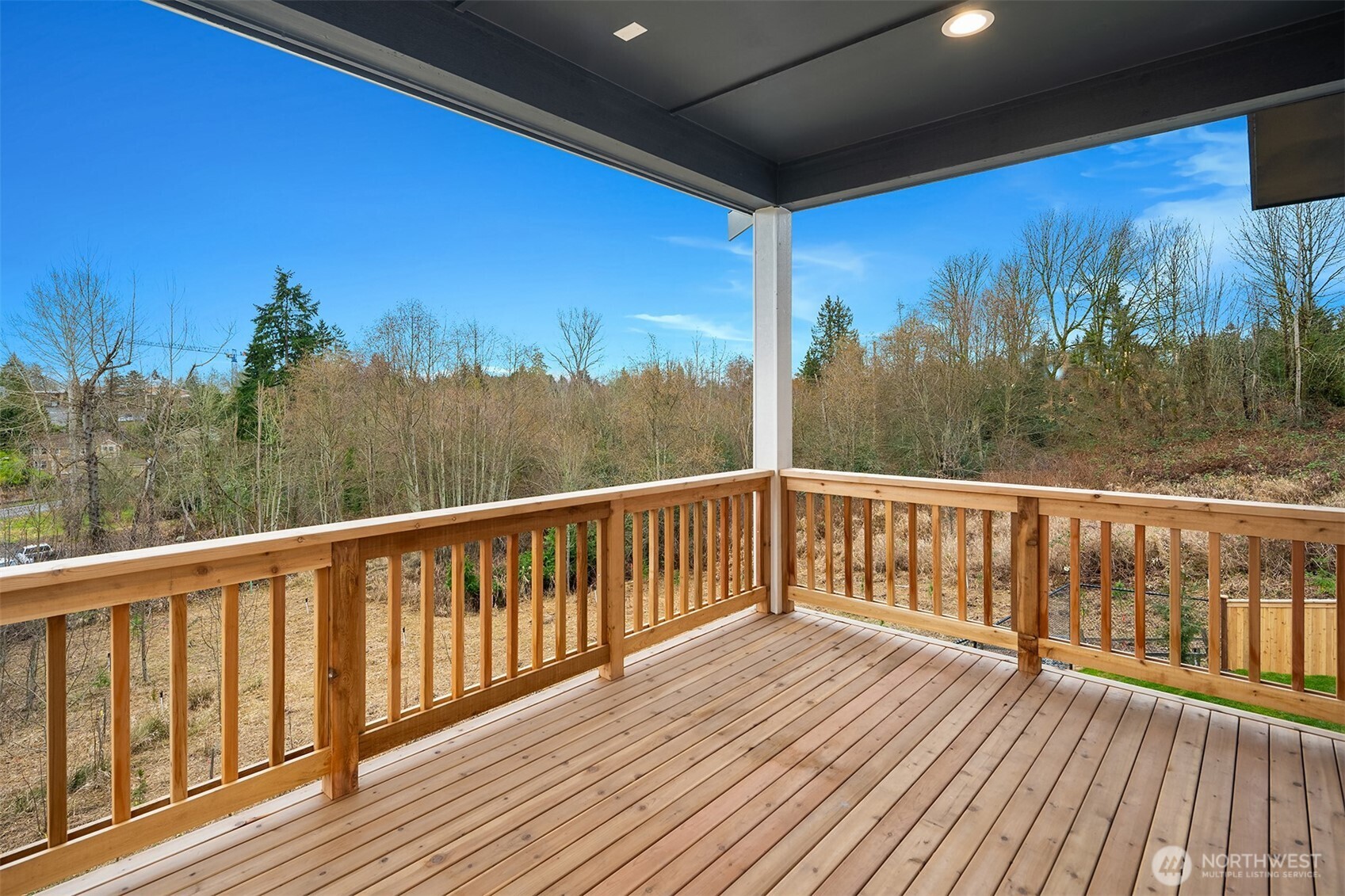 8409 Northeast 156th Street Kenmore, WA 98028 - Photo 13 of 16 a view of balcony with wooden floor and fence