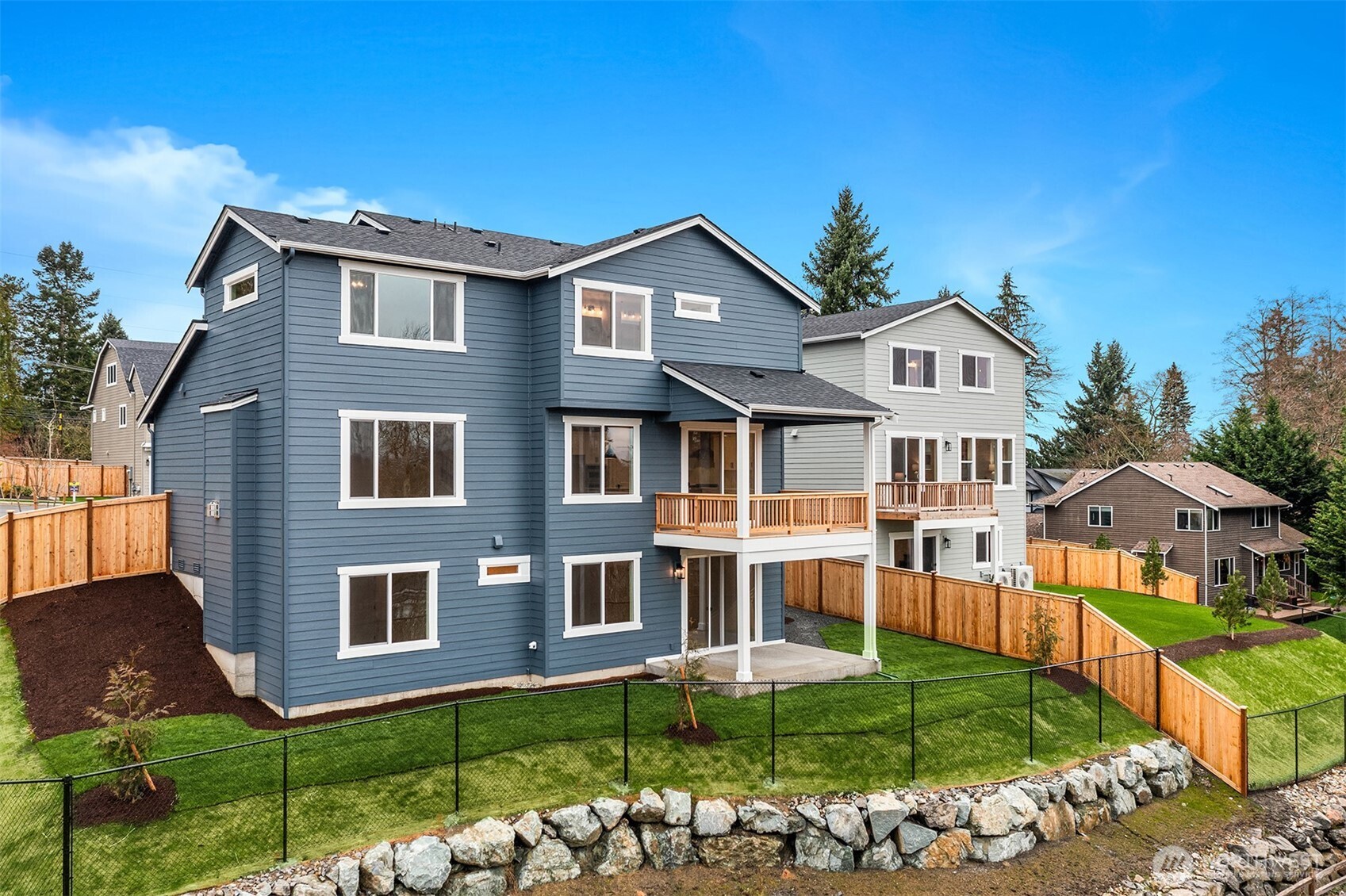 8409 Northeast 156th Street Kenmore, WA 98028 - Photo 14 of 16 a front view of a house with garden