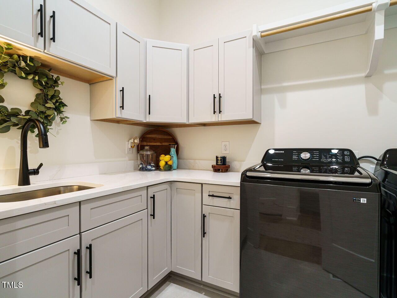6428 Prescott Chase Drive Rolesville, NC 27571 - Photo 23 of 45 a kitchen with white cabinets and appliances