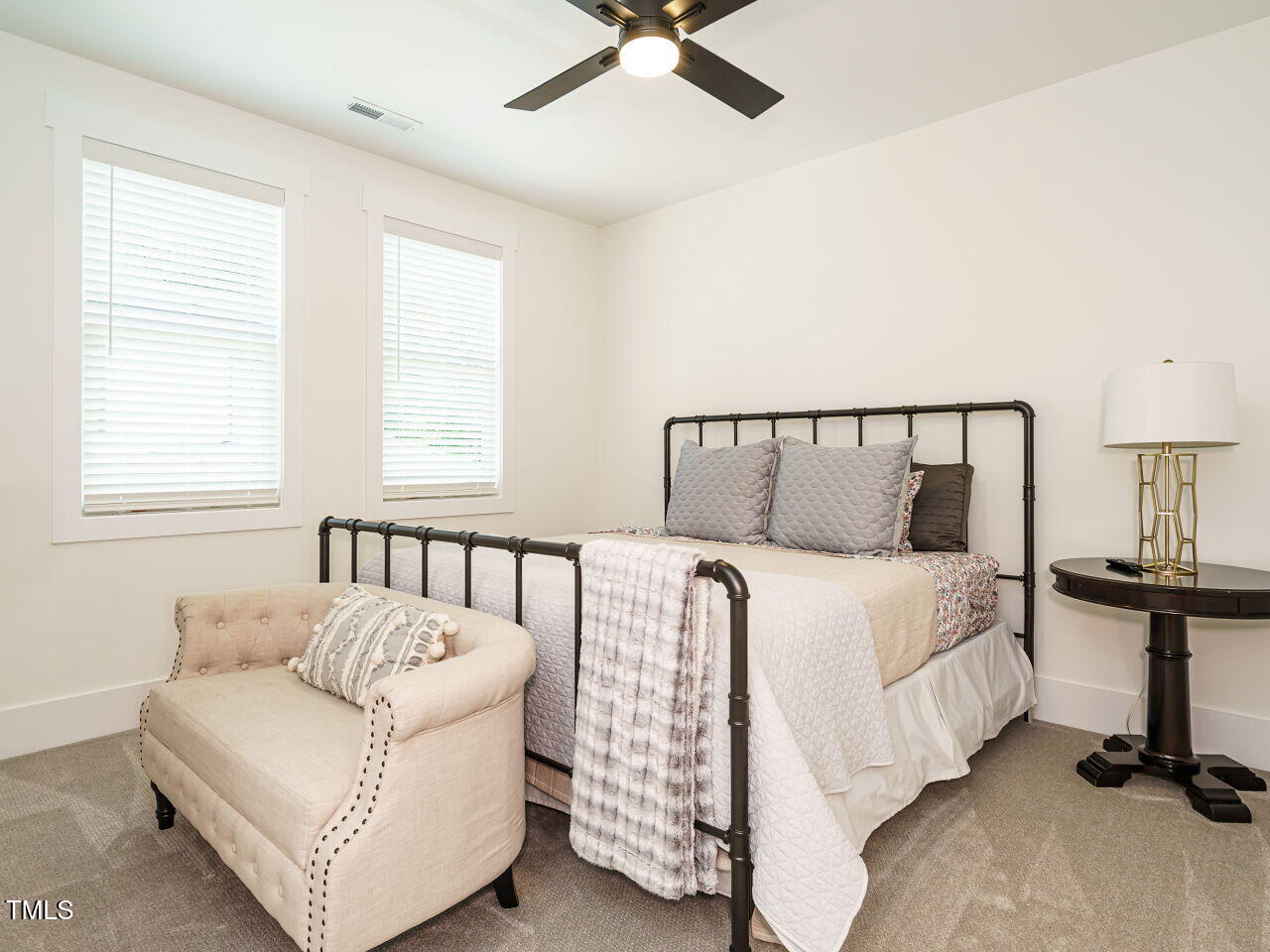 6428 Prescott Chase Drive Rolesville, NC 27571 - Photo 27 of 45 a bed sitting in a bedroom next to a window