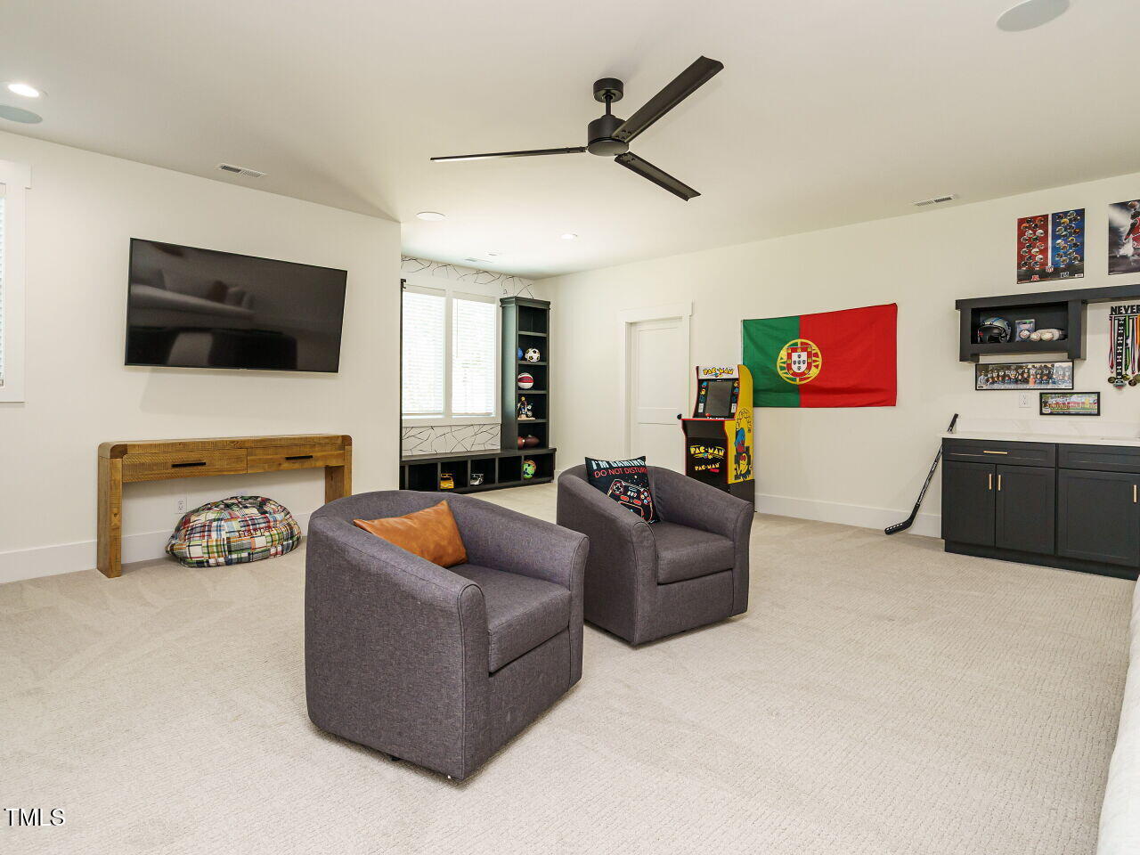 6428 Prescott Chase Drive Rolesville, NC 27571 - Photo 32 of 45 a living room with furniture and a flat screen tv
