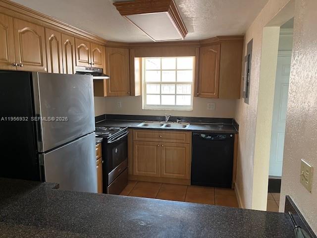 4250 West 11th Lane, Unit 43 Hialeah, FL 33012 - Photo 11 of 31 a kitchen with granite countertop a refrigerator stove and sink
