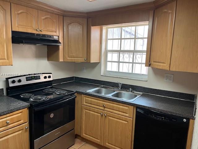 4250 West 11th Lane, Unit 43 Hialeah, FL 33012 - Photo 19 of 31 a kitchen with granite countertop a sink a stove and cabinets